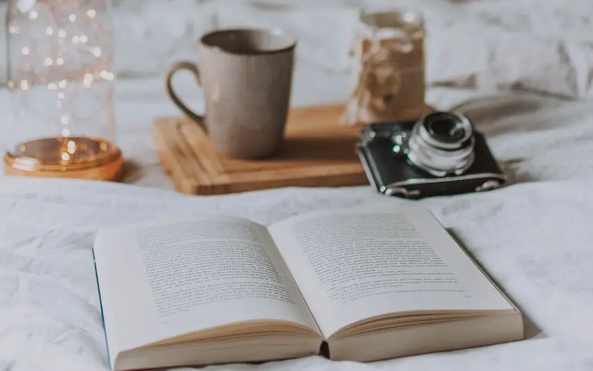 camera, book, candle