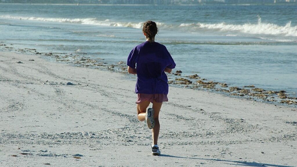 woman jogger, jogging, beach, summer self care